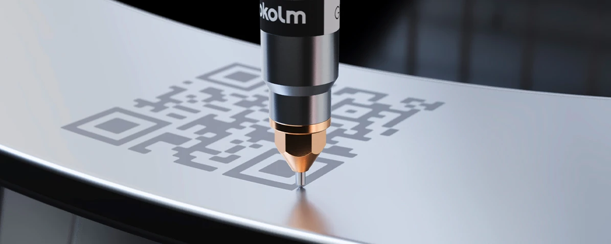The Grafvix pneumatic dot peen marker from Pokolm engraves a serial component with a QR code.