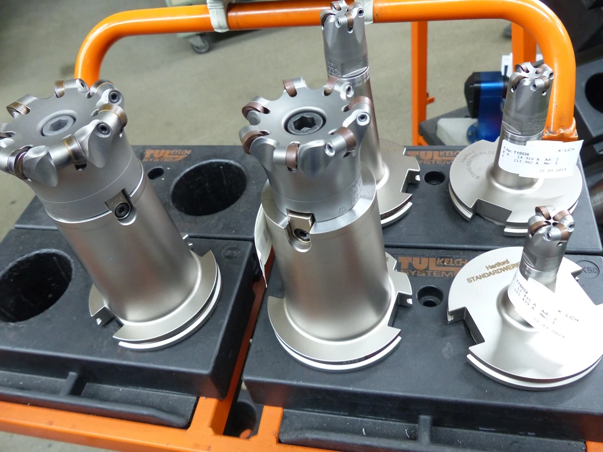 Premiumtool Spinworx from Pokolm screwed onto a holder and placed in a fixture on a workshop trolley. This photo was taken at the Paul Beier company.