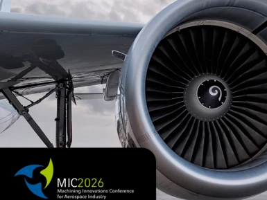 Eine Flugzeugturbine mit dem Logo von MIC (Machining Innovations Conference).