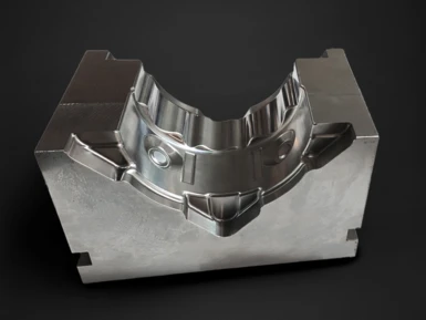 Forming tools for gearbox housings on a black background.