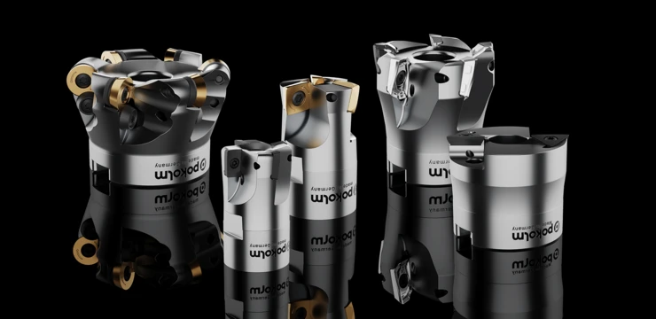 Premium tools from Pokolm are presented on a black background. Round plate insert cutters, Quadworx, Slotworx L, Slotworx VF, and Mirroworx are shown.