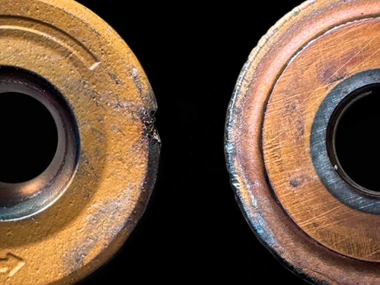 Comparison of a fixed and a self-rotating round insert after use.