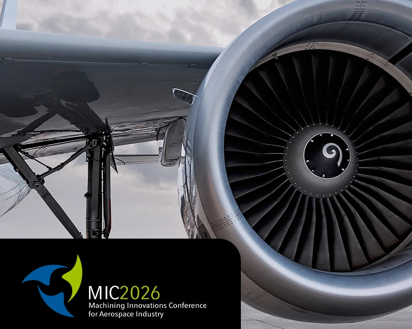 Eine Flugzeugturbine mit dem Logo von MIC (Machining Innovations Conference).